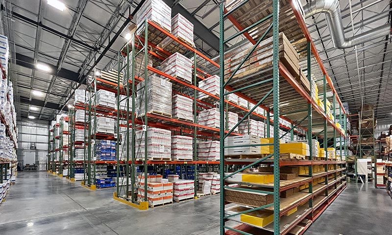 Climate-controlled Church Paper warehouse with palletized inventory stored on warehouse racks